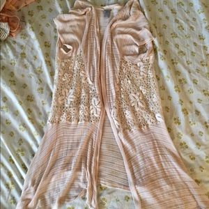 Cream colored, short sleeved, lacy cardigan
